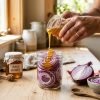 Pouring_honey_on_red_onions_202608270131